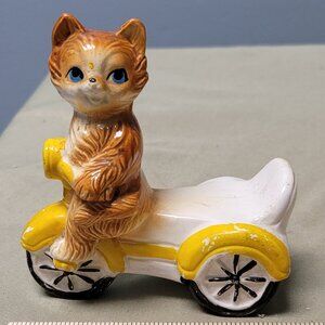 Vintage cat on a 3 wheeler shaker